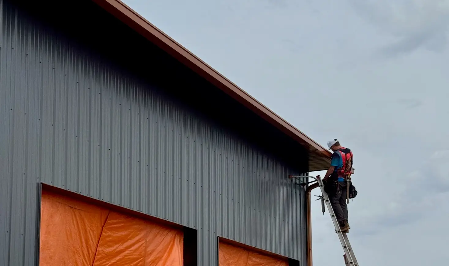 Copper box-style gutter installation on a premium home