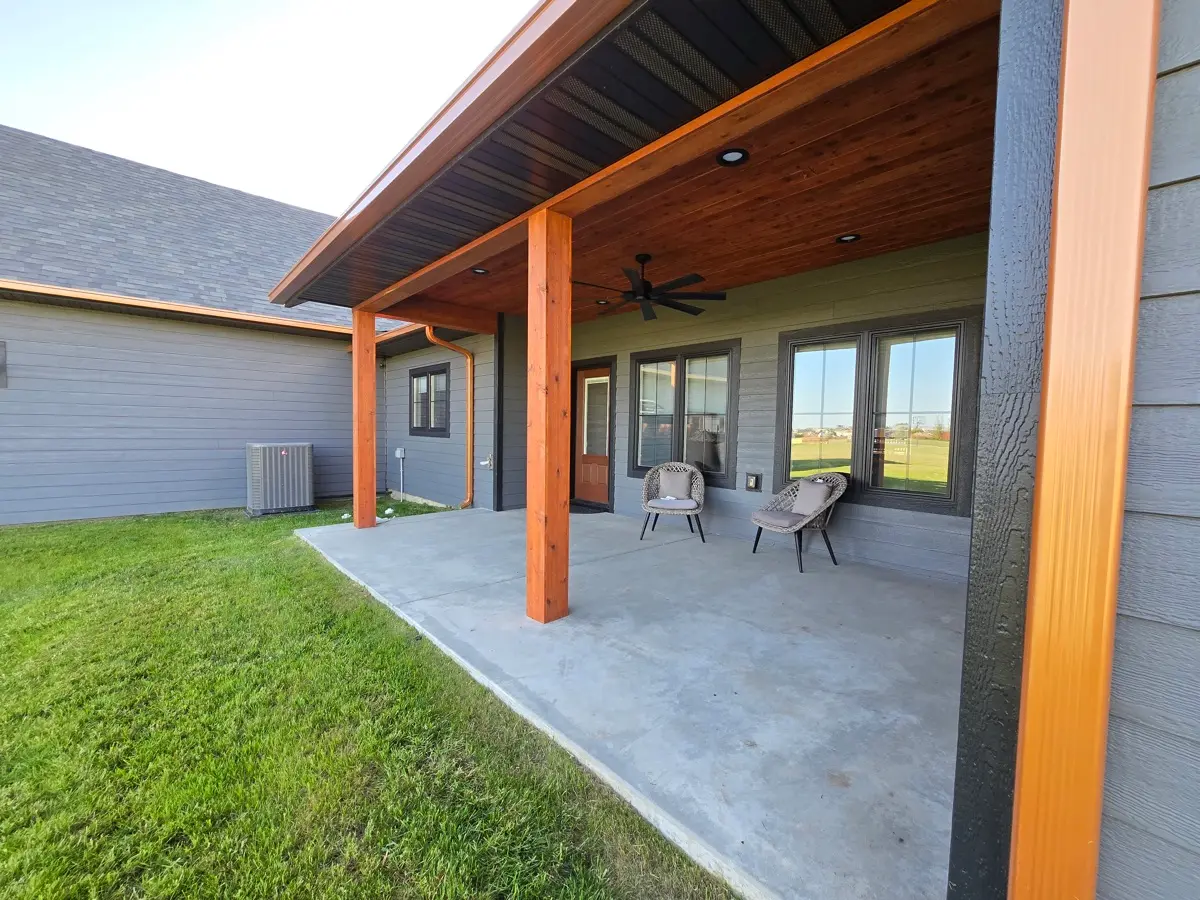 Seamless gutter above a covered lakeside patio near Annandale
